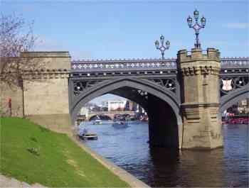 Picture of Skeldergate bridge in York with Ouse bridge through its arches in the background.